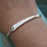 Sterling silver hammered clasp bangle