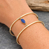 Unusual brass cuff bracelet with Lapis Lazuli