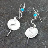 Unusual contemporary silver dangly earrings with discs and Turquoise stone