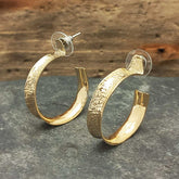 Hug brass semi-hoop earring
