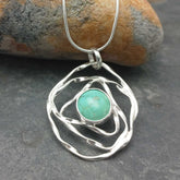 Unusual silver web pendant with Turquoise stone