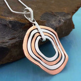Copper & Silver Curvy Circle Pendant
