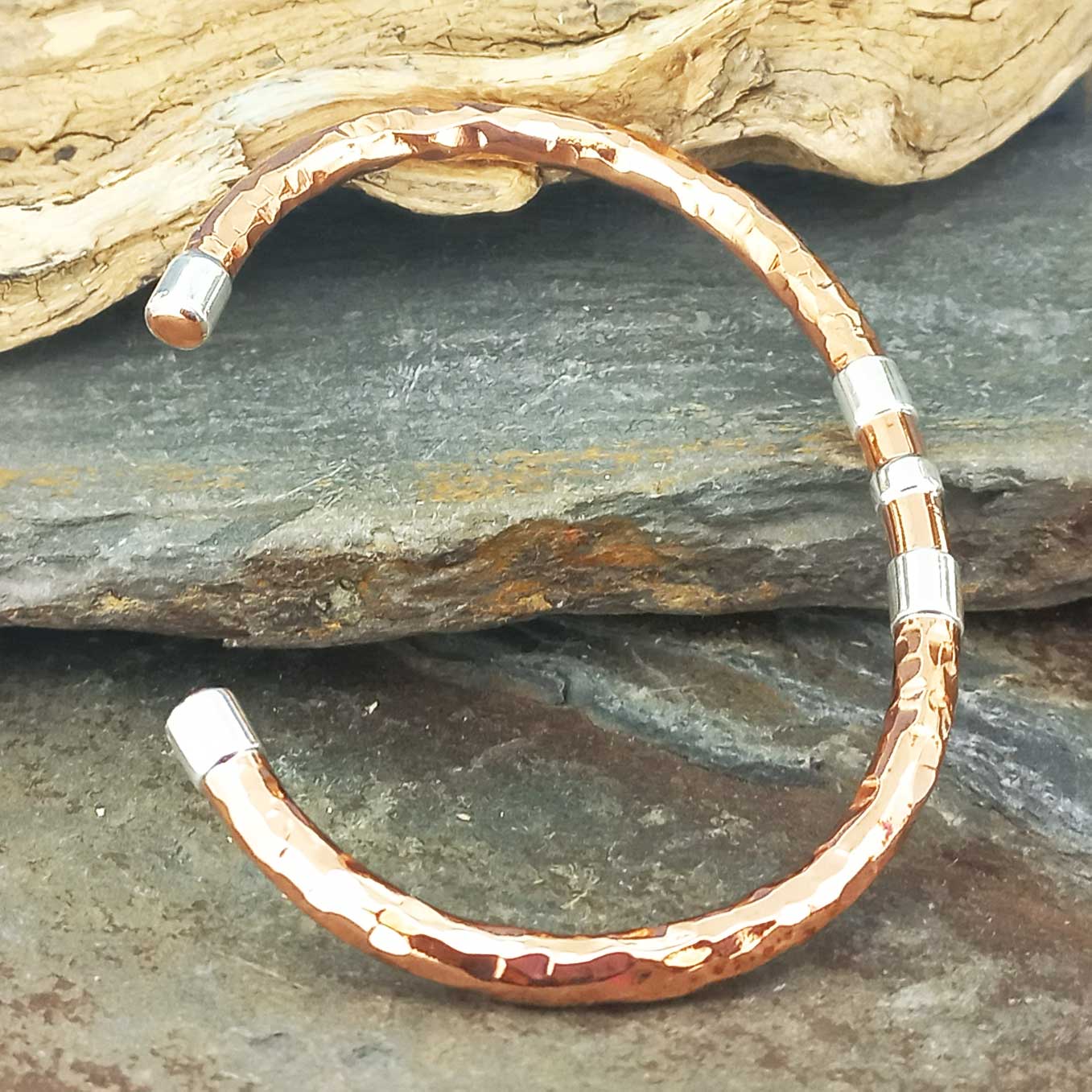 Hammered copper cuff bracelet with silver detail