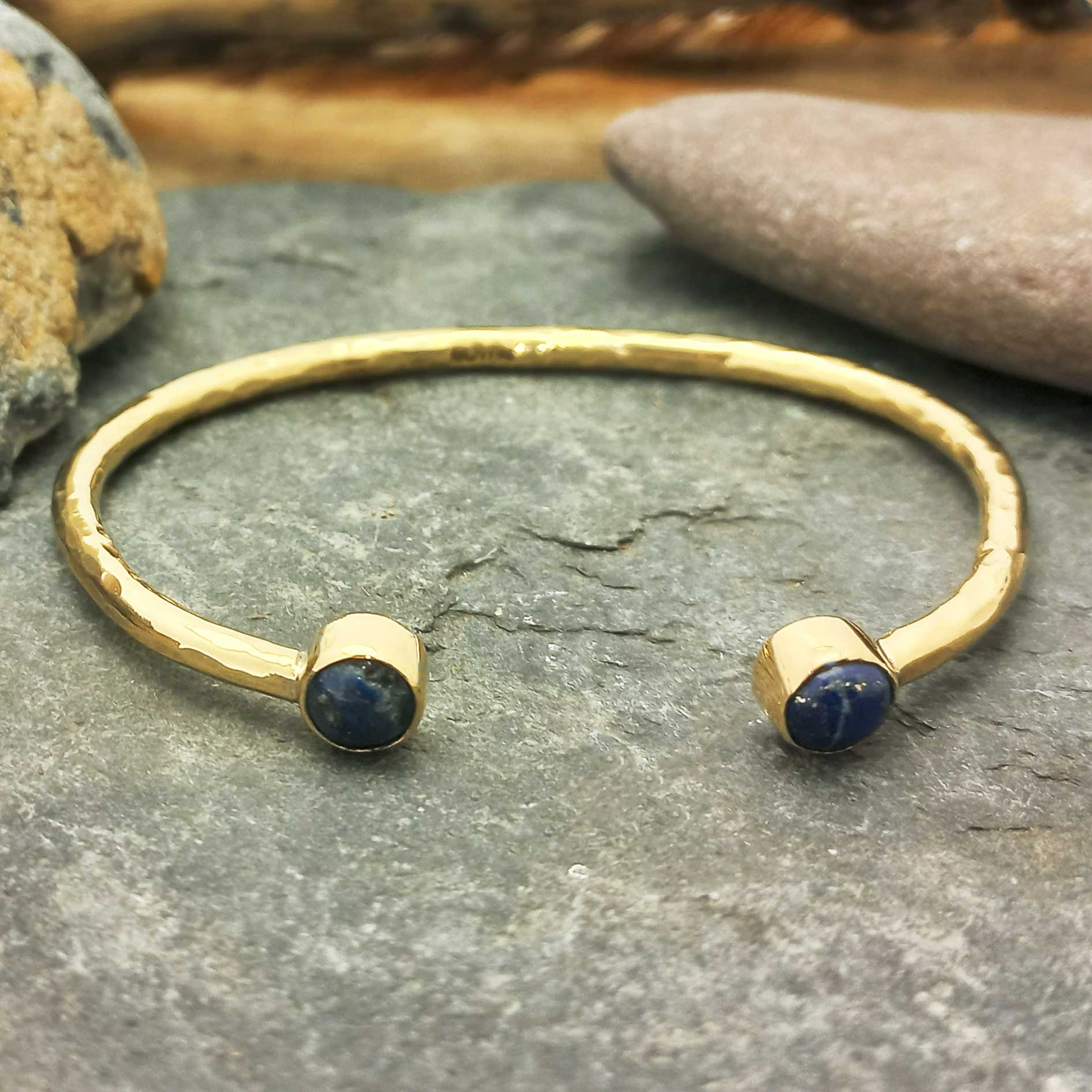 Unusual Gold coloured cuff bracelet with Lapis stones