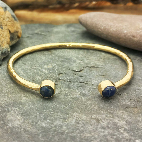 Unusual Gold coloured cuff bracelet with Lapis stones