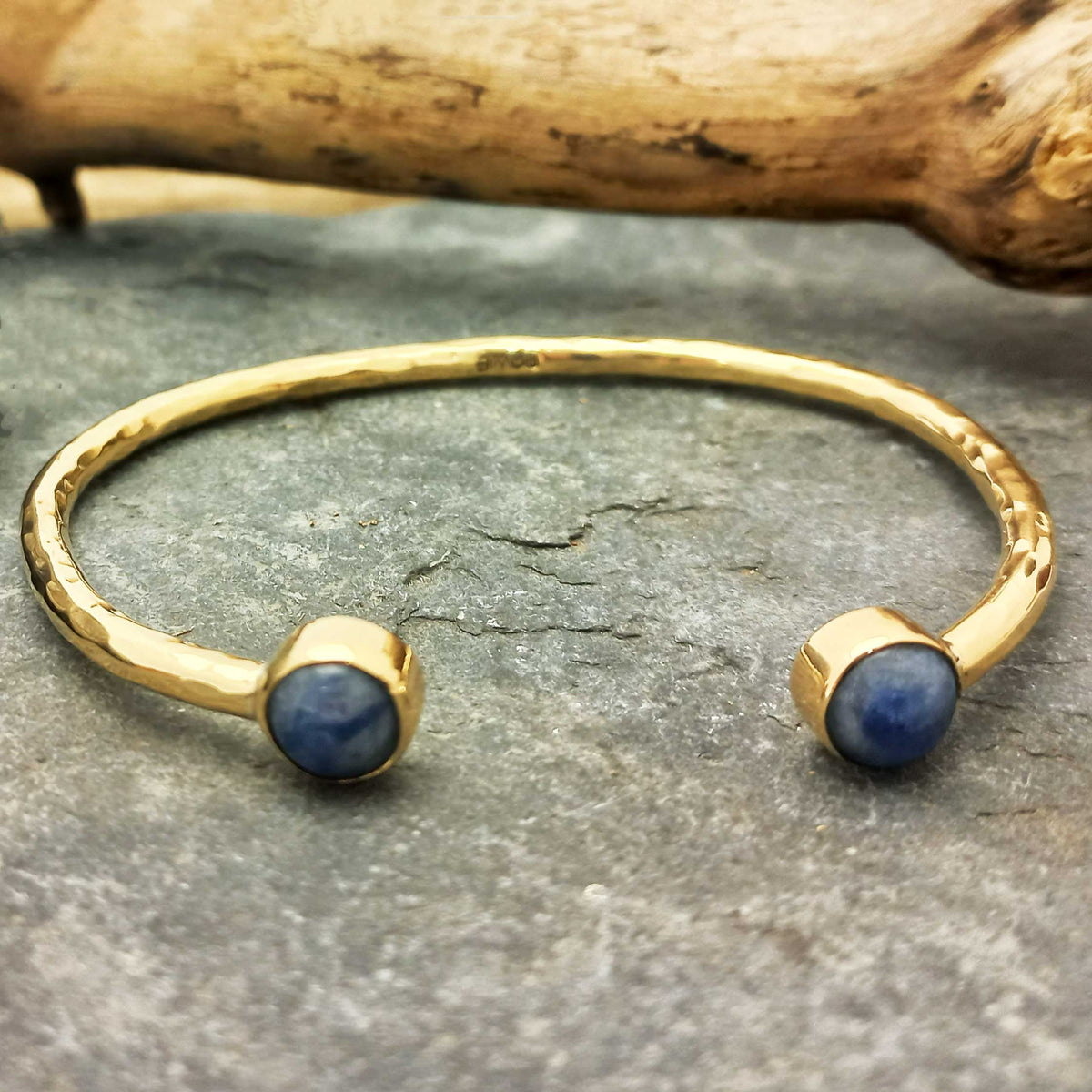 Handmade hammered brass cuff bracelet with Sodalite stones.