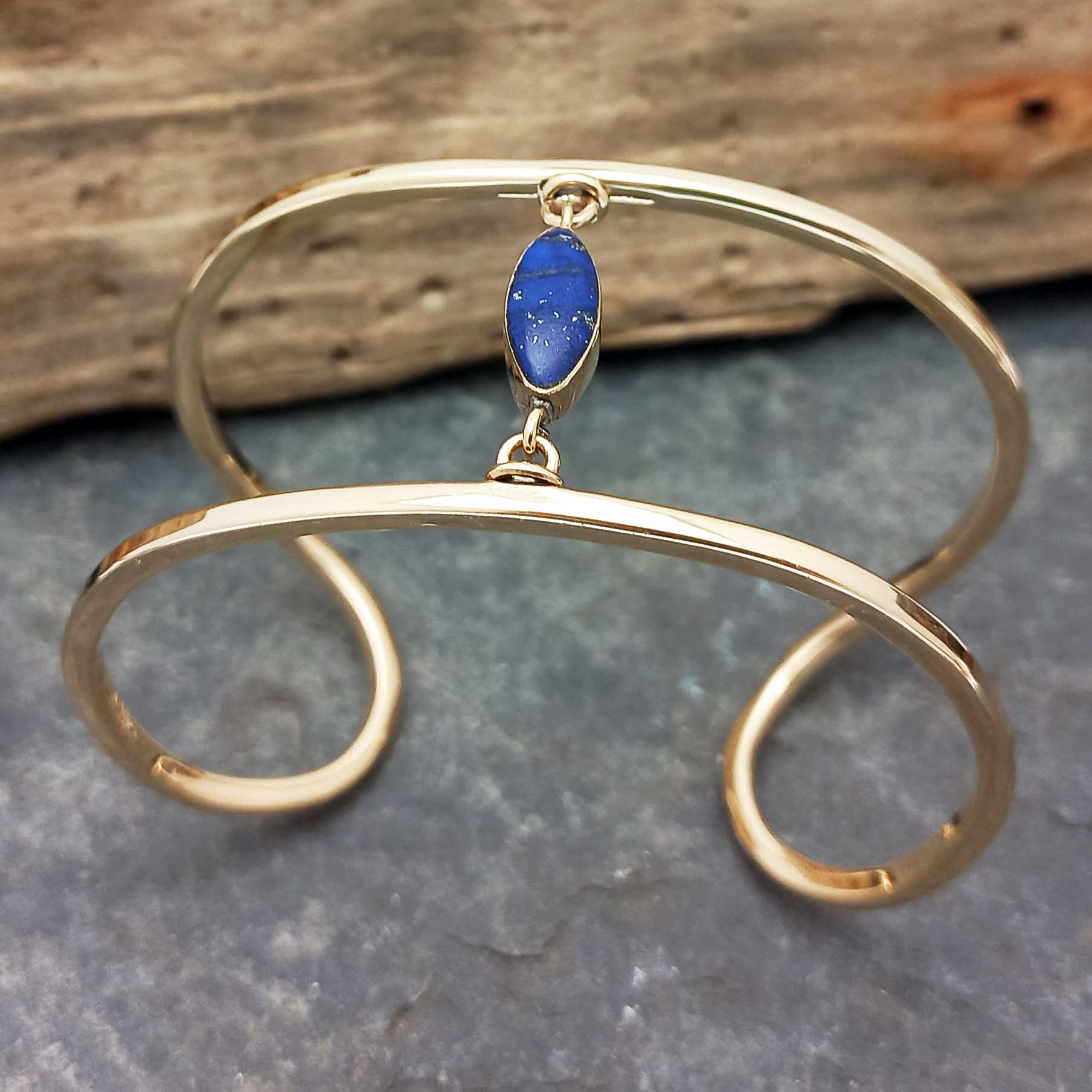 Handcrafted unusual brass cuff with Lapis stone