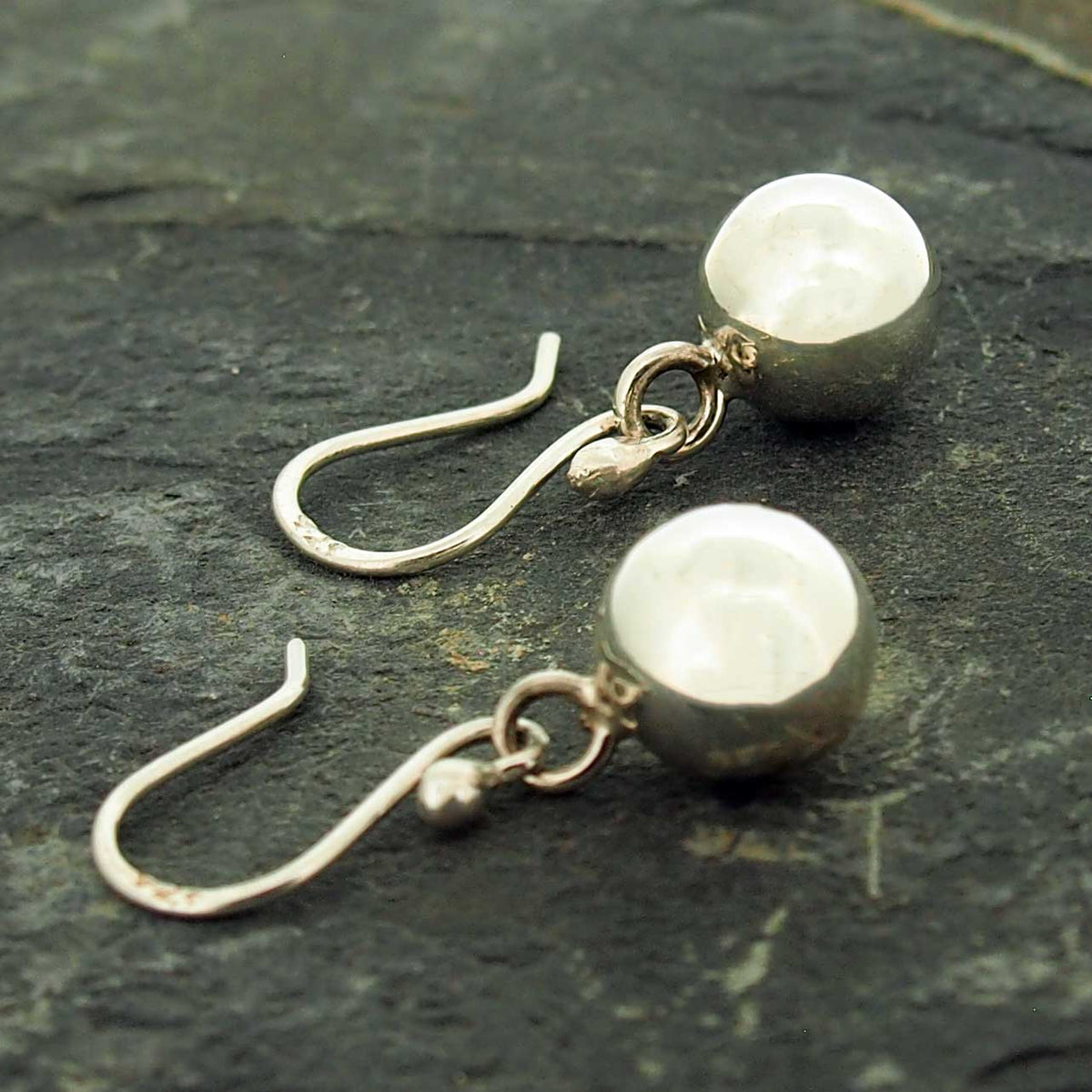 Polished silver ball drop earrings