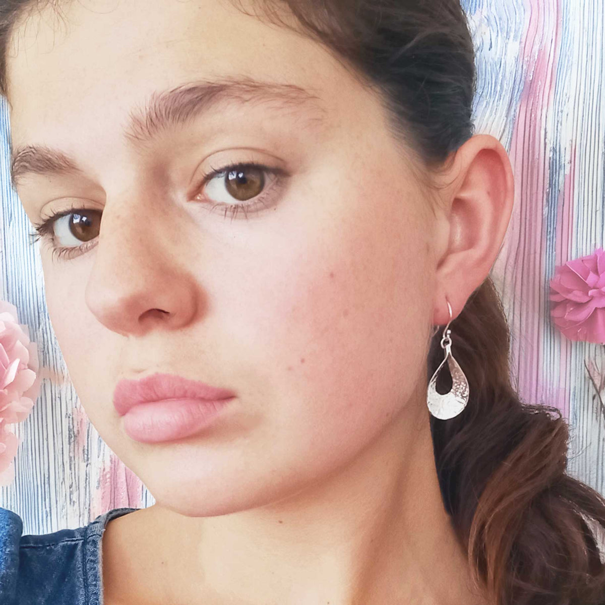 Handmade hammered teardrop silver earrings Main image