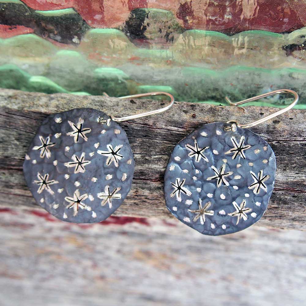 handmade silver disc earrings with cut out gold stars