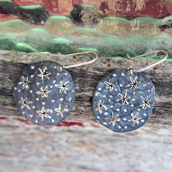 handmade silver disc earrings with cut out gold stars