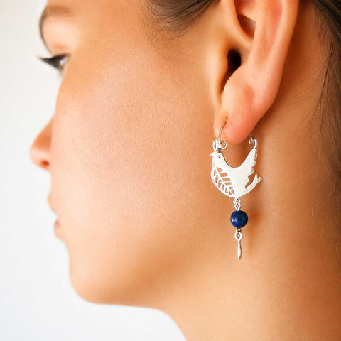 Silver earring with a lapis bead