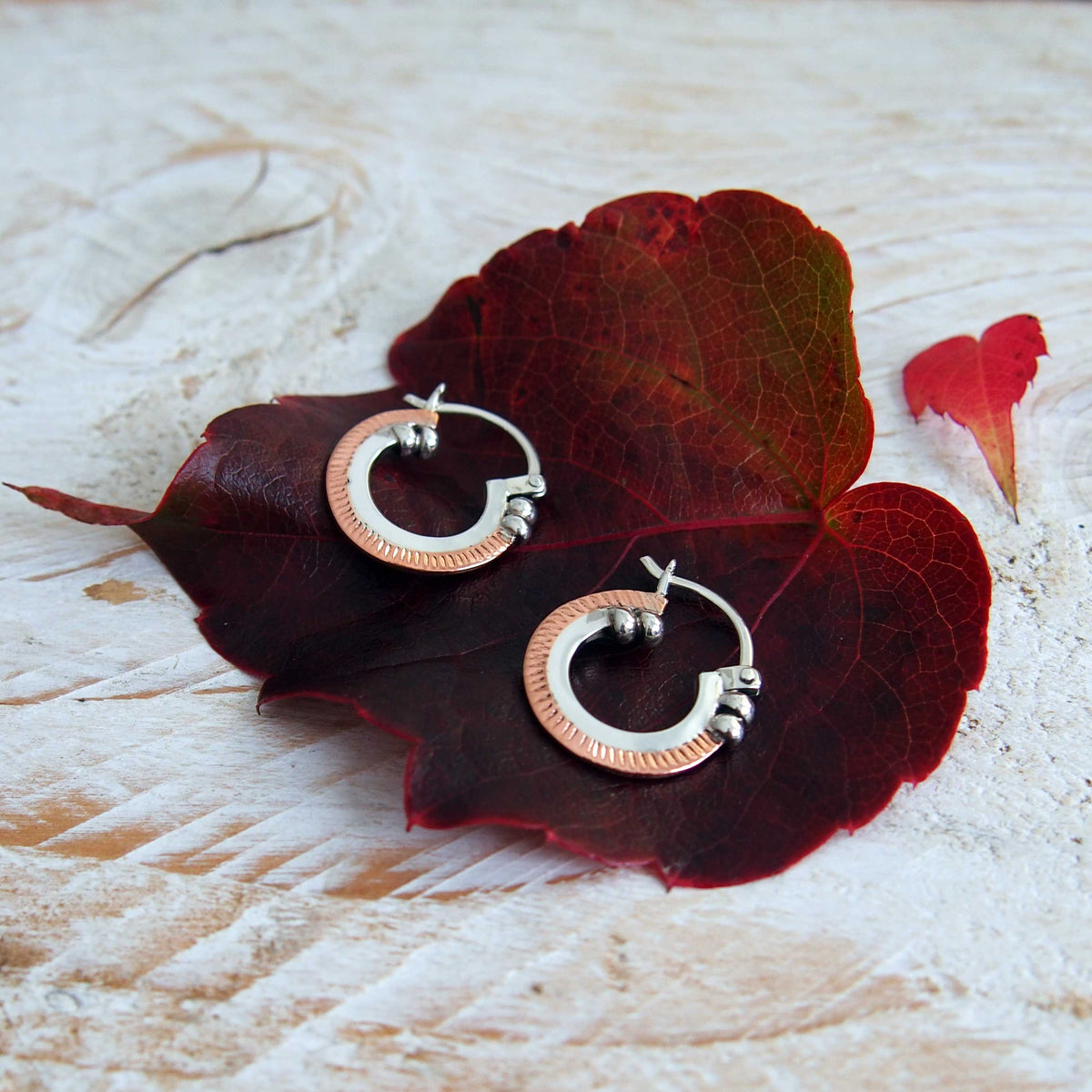 Copper Trimmed Silver Hoop Earrings Main image