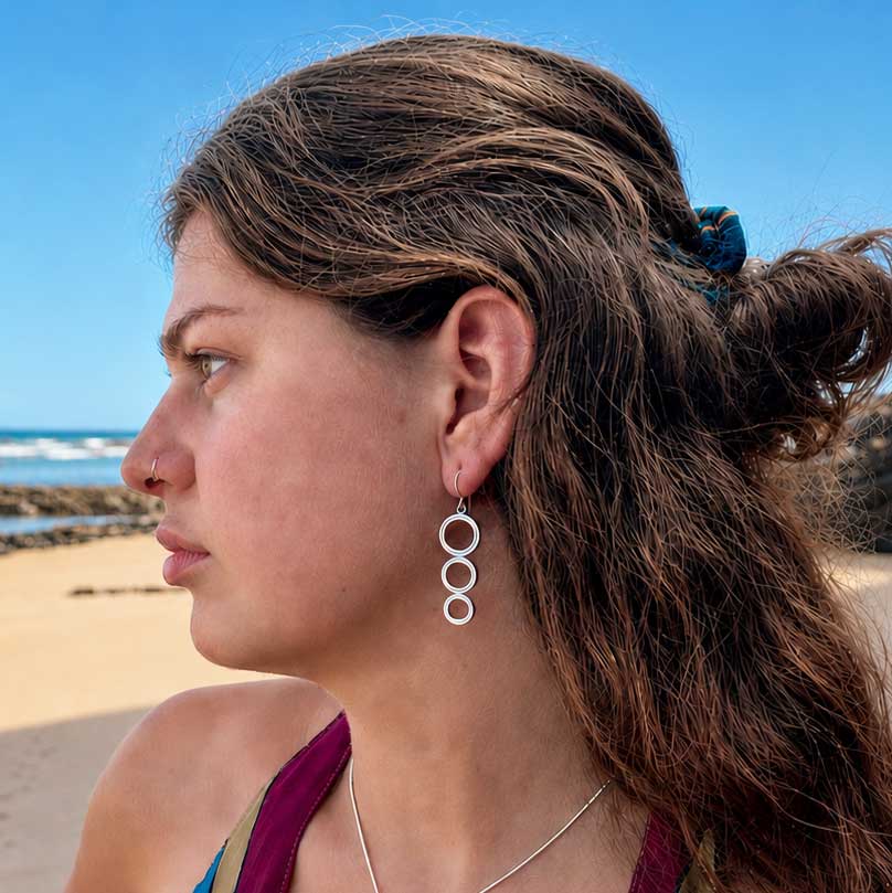 Sterling silver dangle handcrafted earrings with 3 stacked circular rings