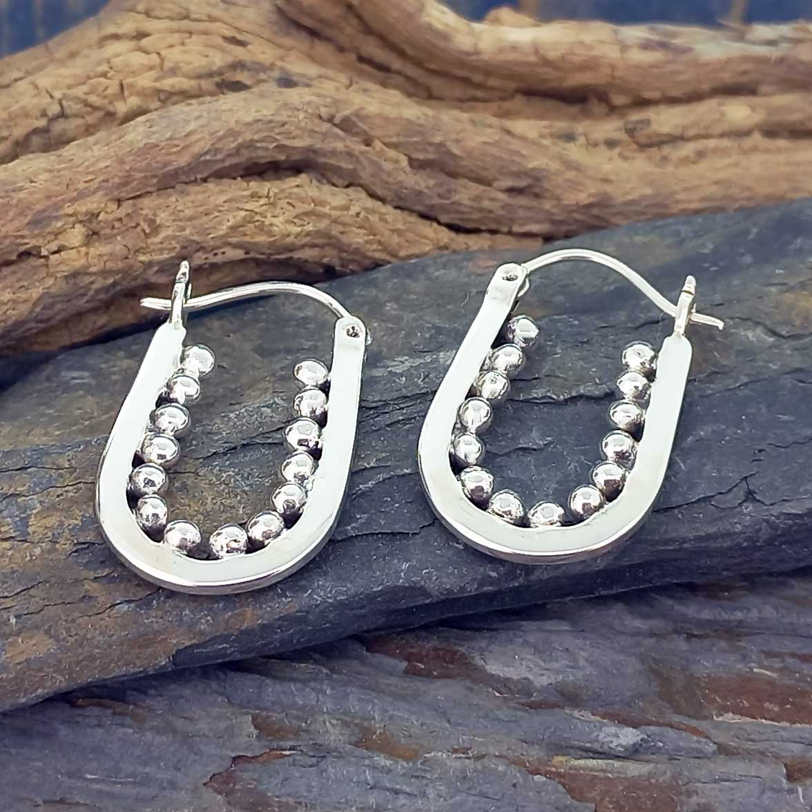 Handmade Unusual designer silver hoop earrings