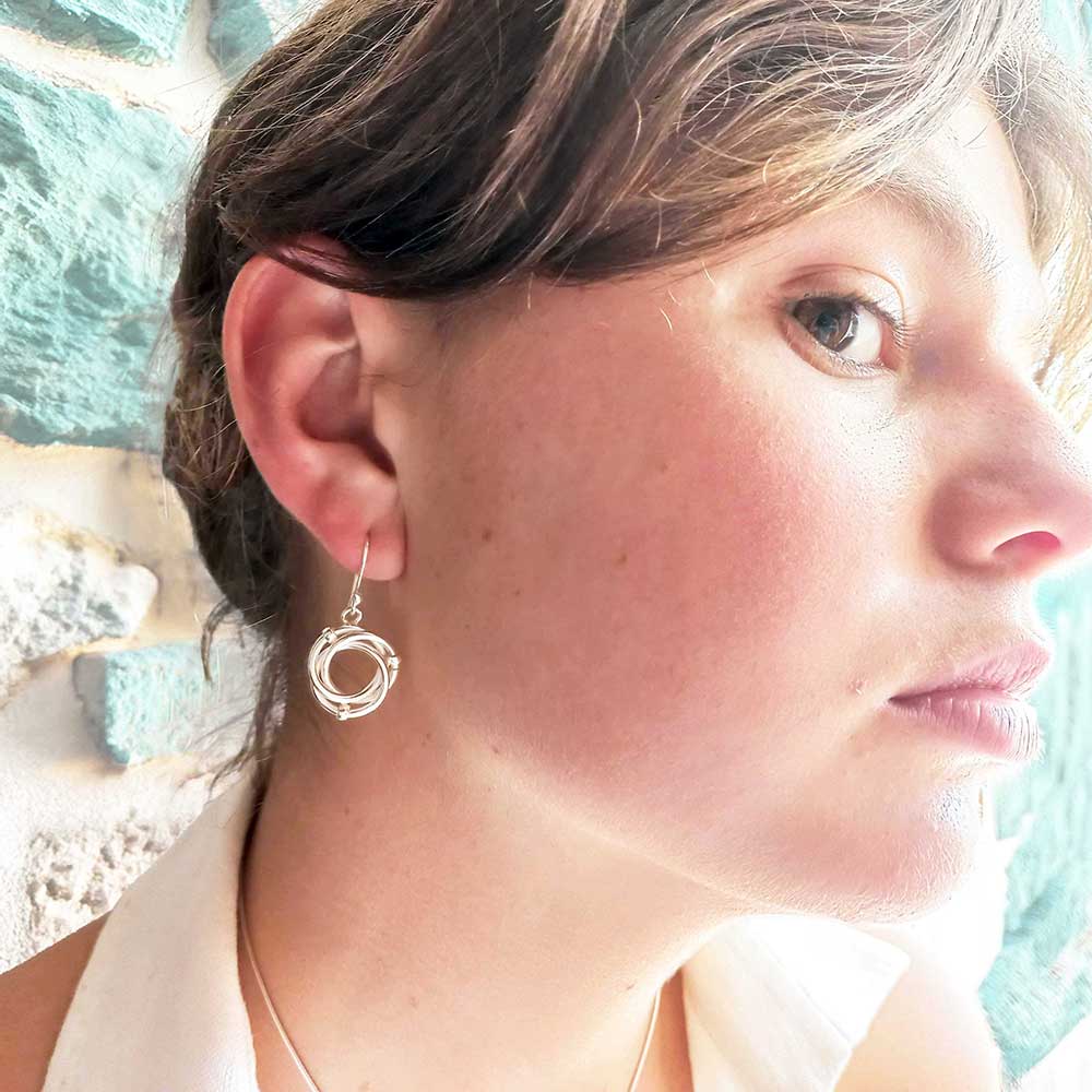 Enclosed circles bead silver drop earrings Main image