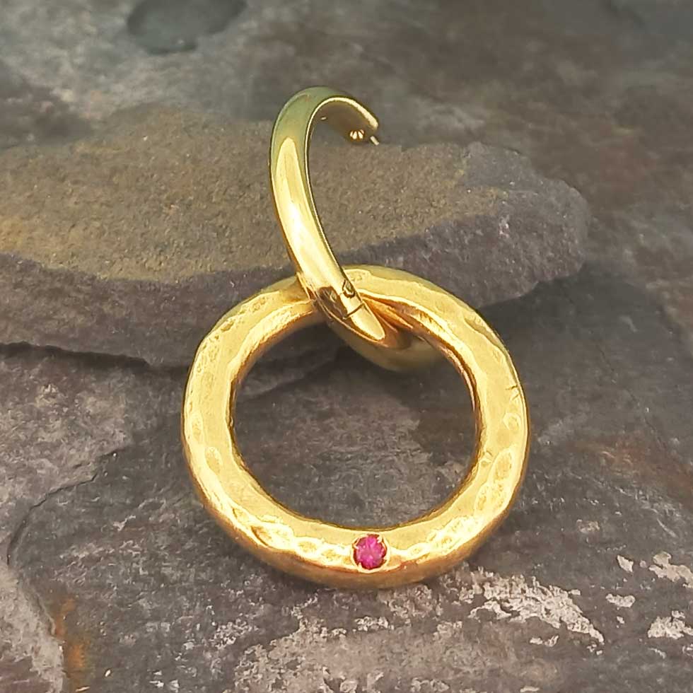 Contemporary textured gold-plated circle earring with red glass circle