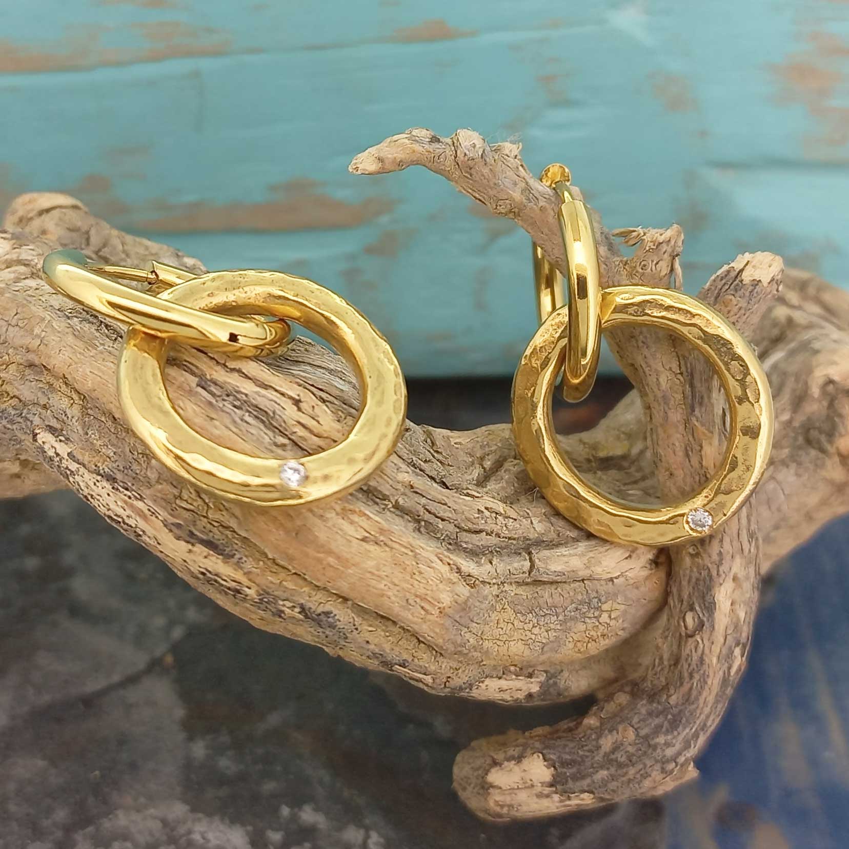 Gold plated textured hoops with white glass