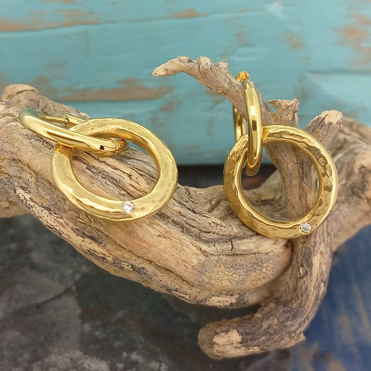 Gold plated textured hoops with white glass