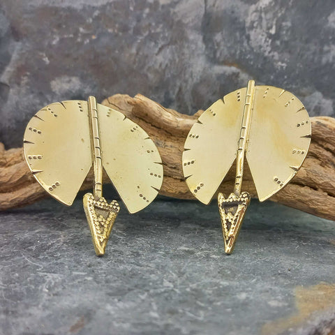 A pair of gold-toned arrow-shaped unusual stud earrings with fan-shaped backplates and textured triangular tips.