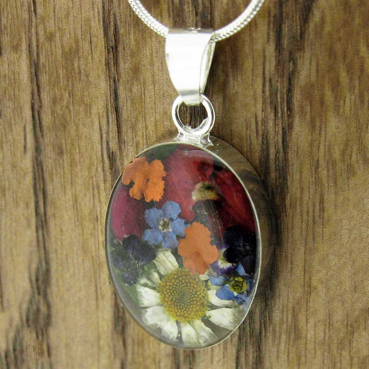 Oval shaped silver flower pendant Main image