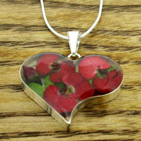 Real pressed poppies in silver heart shaped pendant