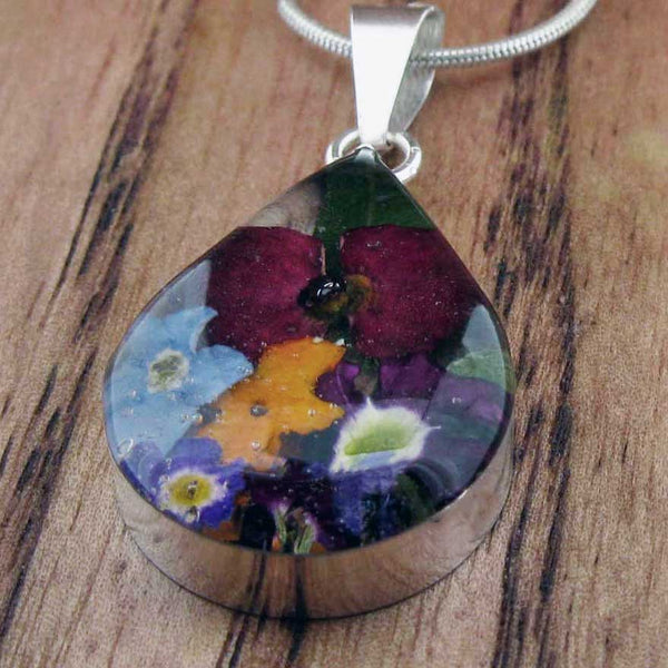Small silver teardrop pendant with real pressed flowers