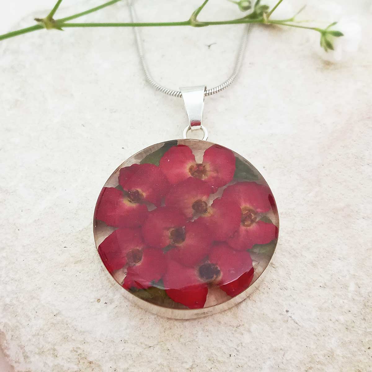 Round silver necklace with red real pressed poppy flowers