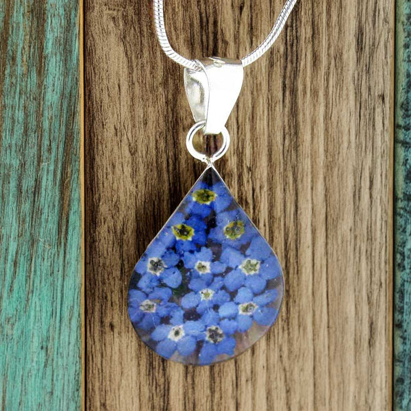 Teardrop silver pendant with real forget-me-not flowers