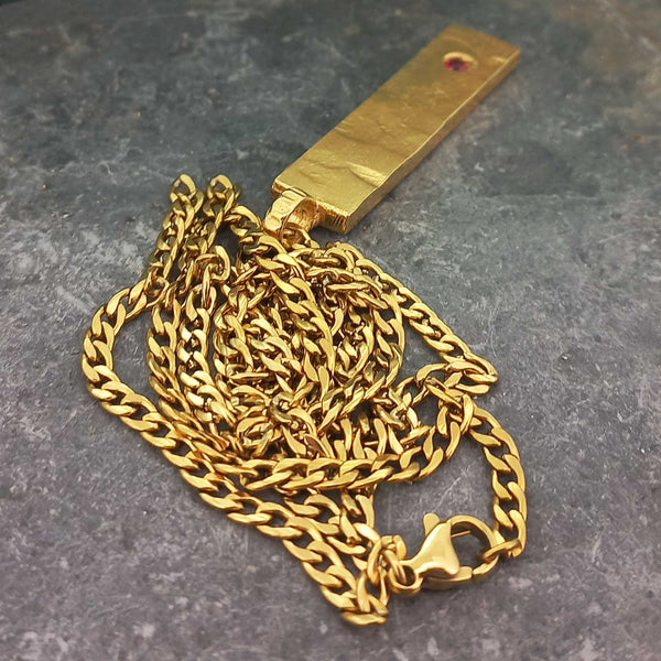 Gold plated chain and bar with red glass cabochon necklace