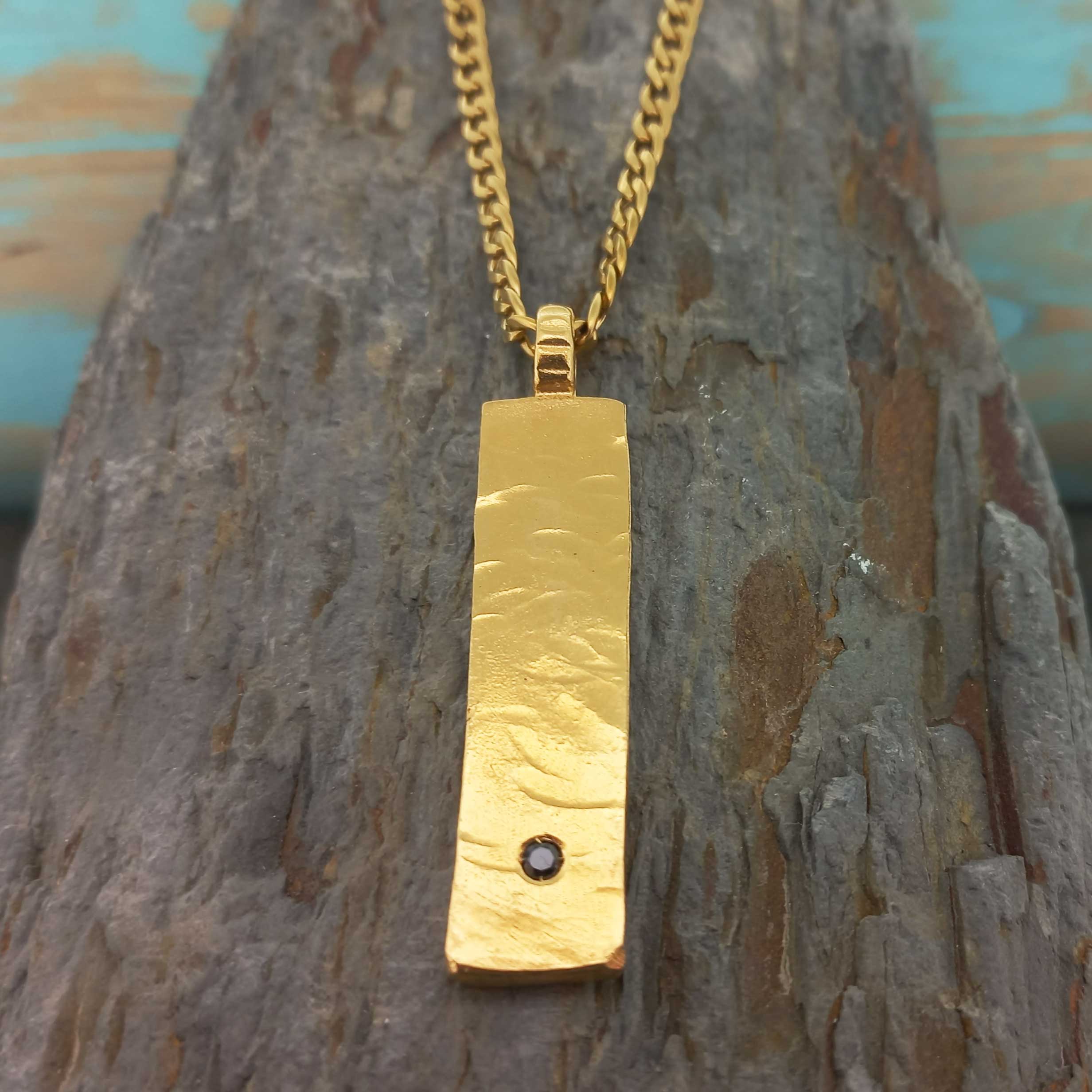 Contemporary artisan jewellery with gold-plated bar necklace