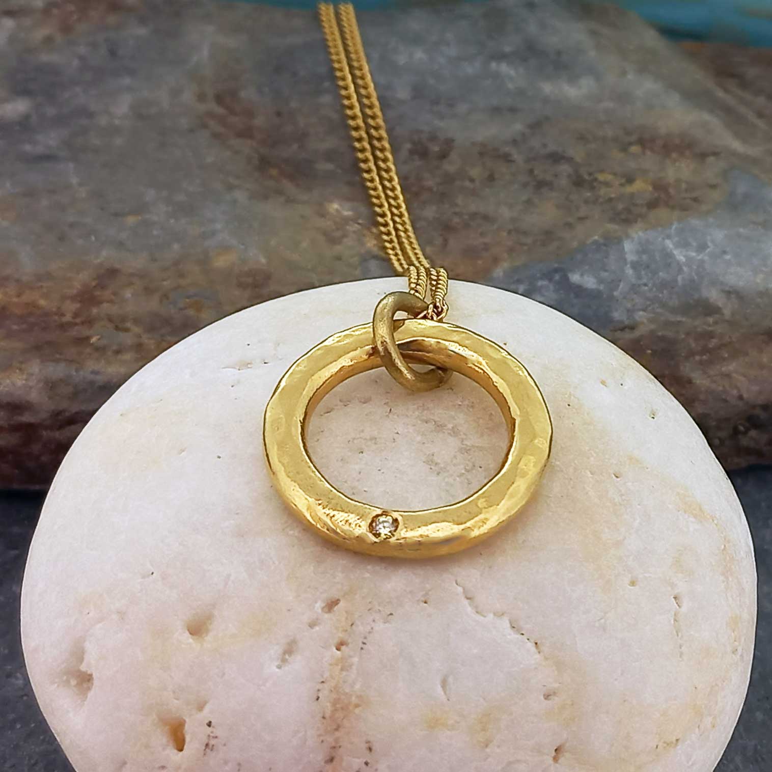 Handmade artisan brass circular pendant plated in gold