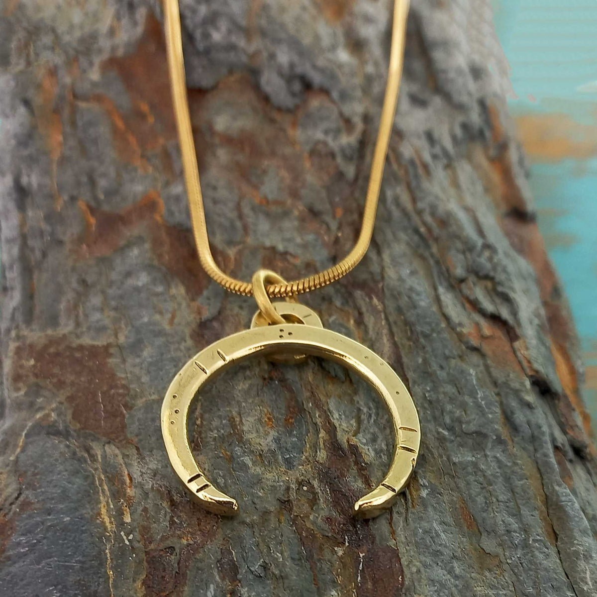 Crescent moon brass gold coloured necklace
