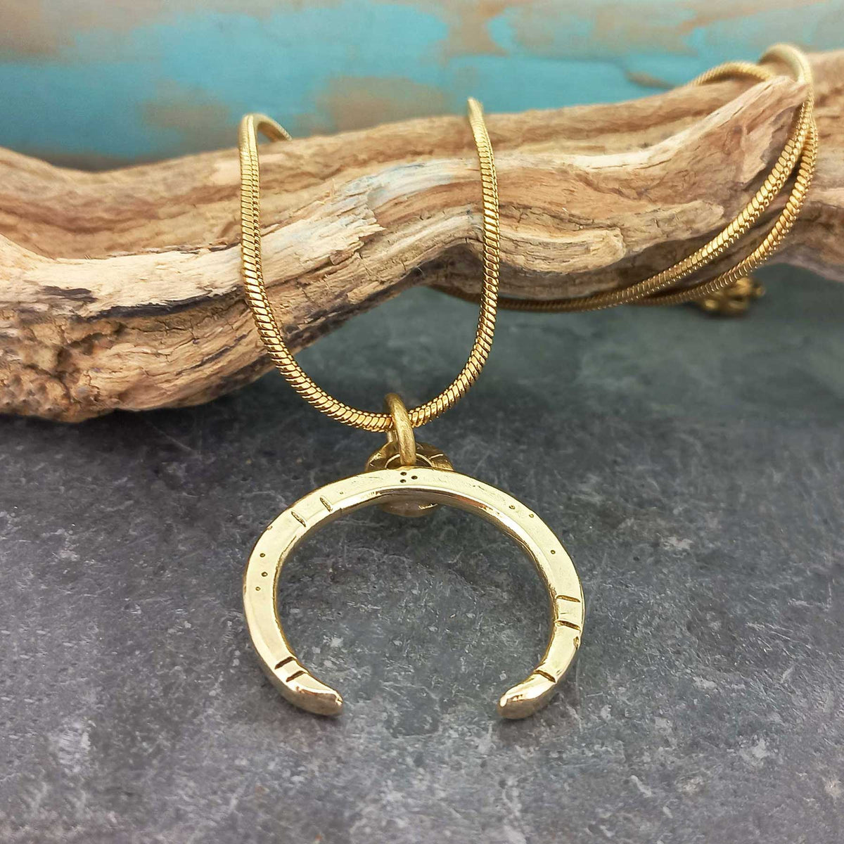 Unusual brass crescent moon necklace, gold plated chain