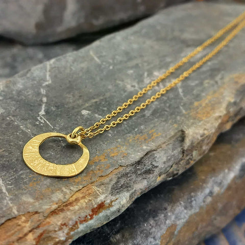 Textured brass ethnic eclipse pendant