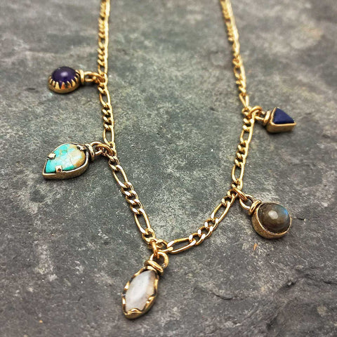Gold coloured brass necklace with various semi-precious stone charms