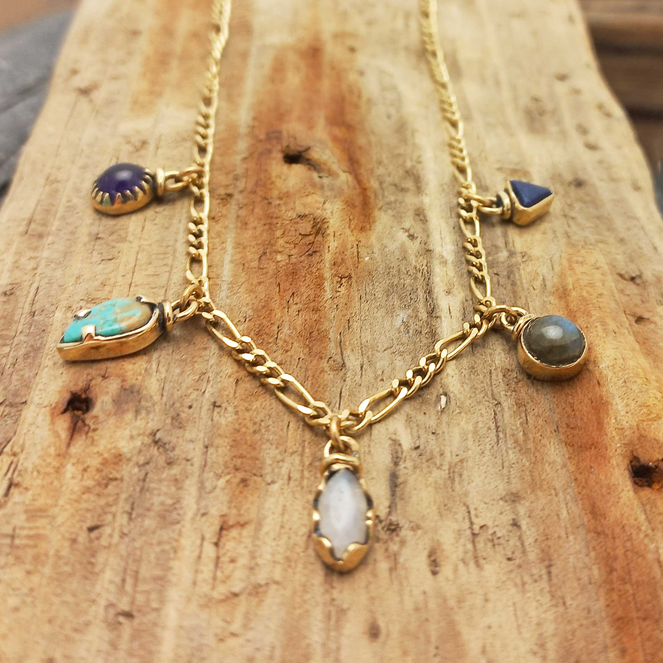 Artisanal brass necklace with gemstone charms