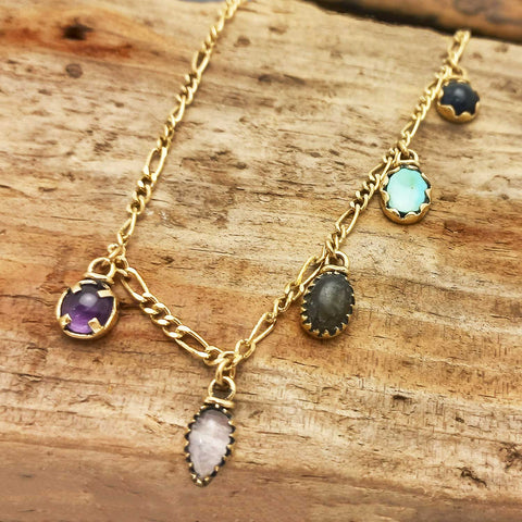 Charm necklace gold hued with amethyst, moonstone, onyx, turquoise, sodalite