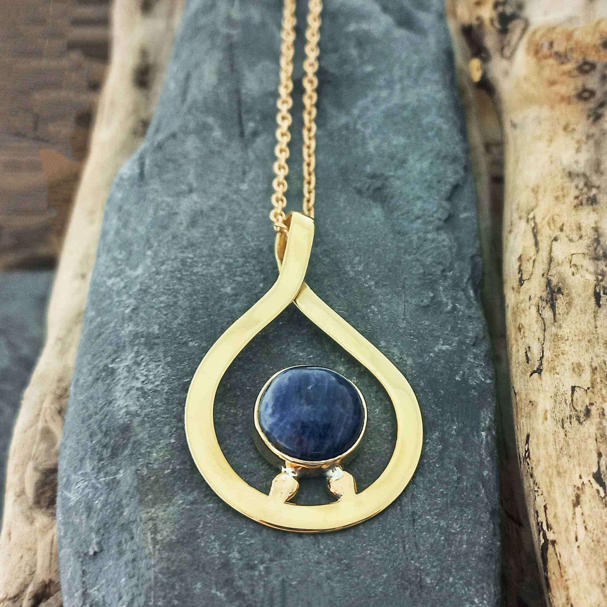 Handmade gold coloured necklace with a blue Sodalite stone pendant