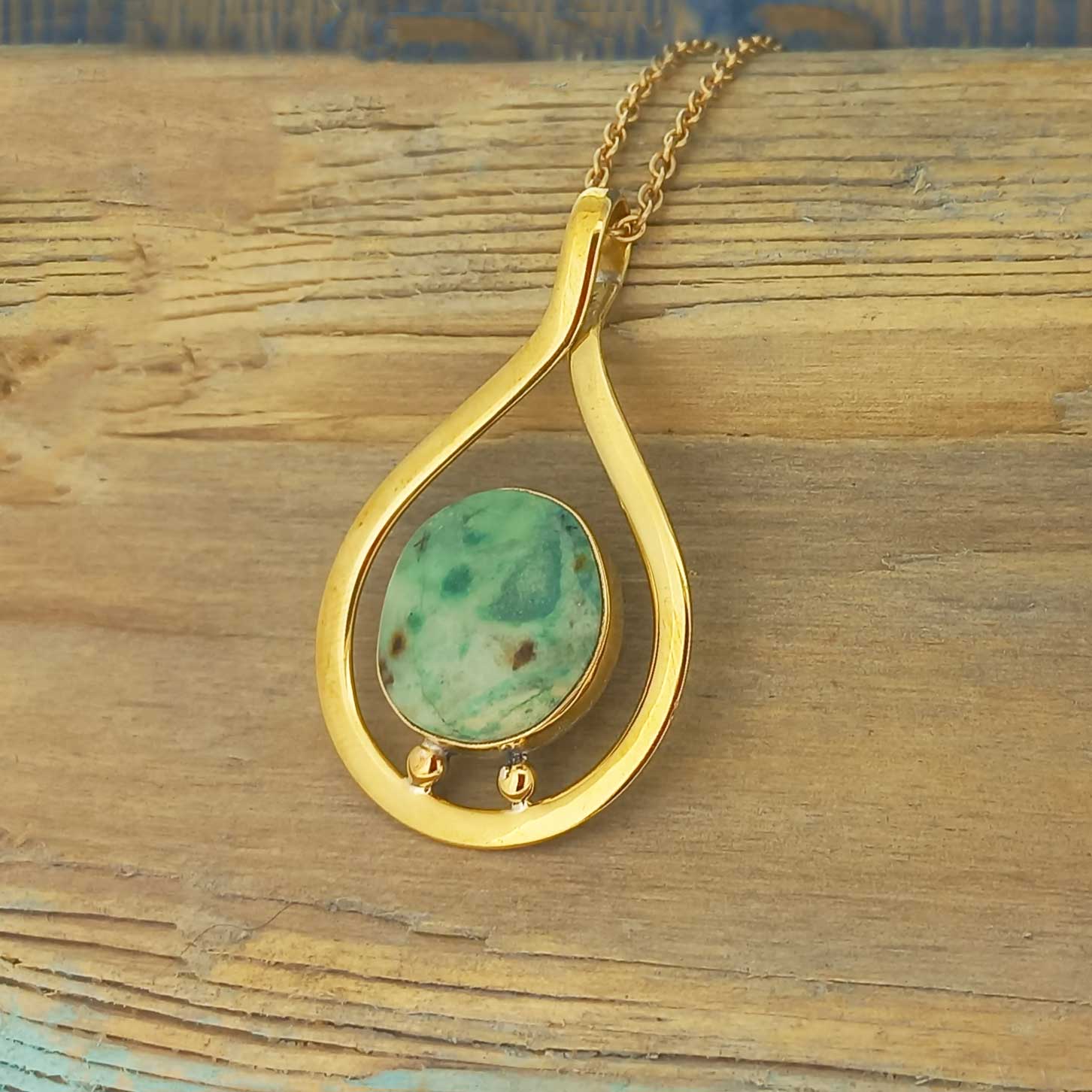 Unusual gold-brass pendant necklace with stone