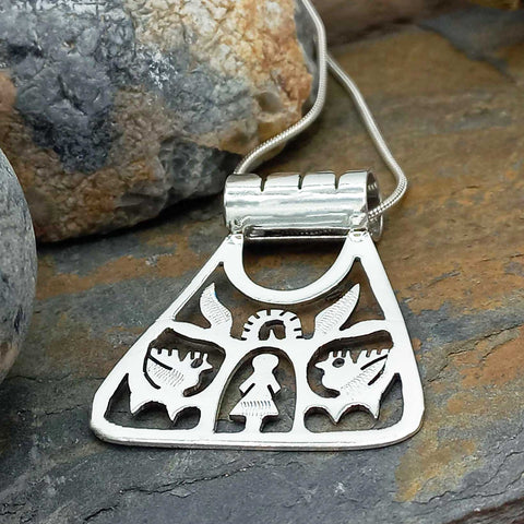 Folk art silver pendant from Mexico
