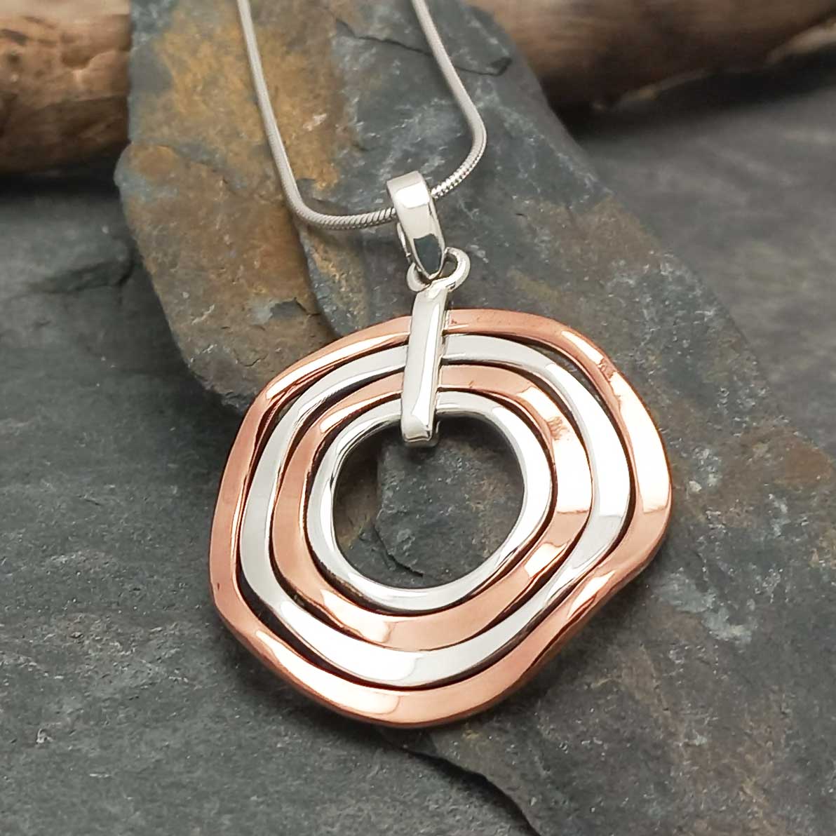 Unusual silver copper round necklace