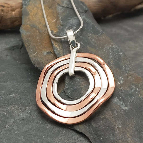 Unusual silver copper round necklace