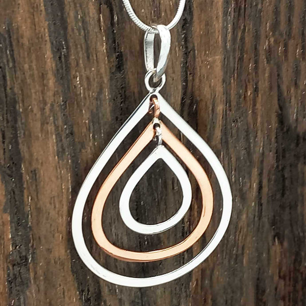 Unsusual silver copper teardrop pendant