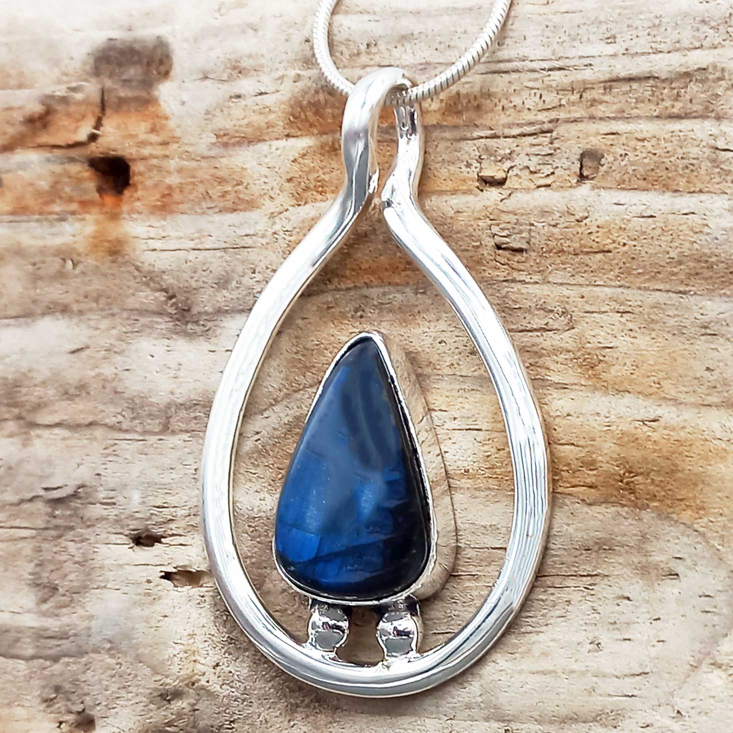 Labradorite handmade sterling pendant on wood
