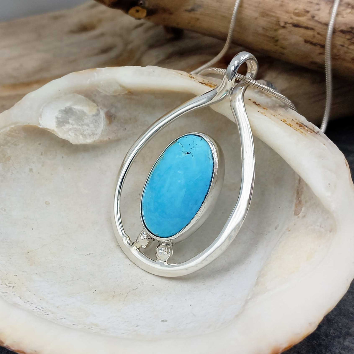 Silver pendant with Larimar on a shell Main image