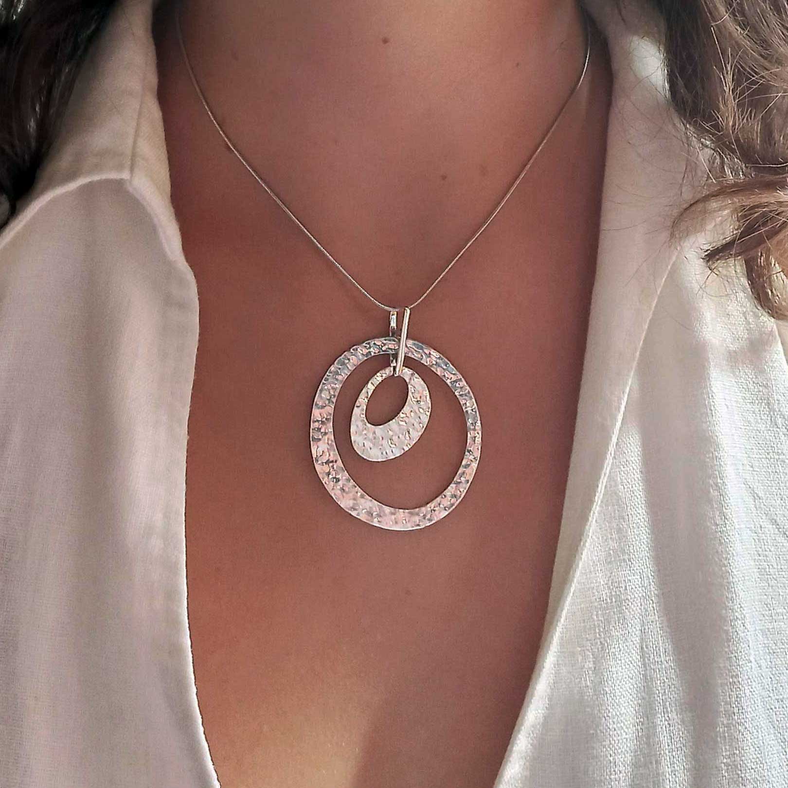 Unusual silver statement circular pendant