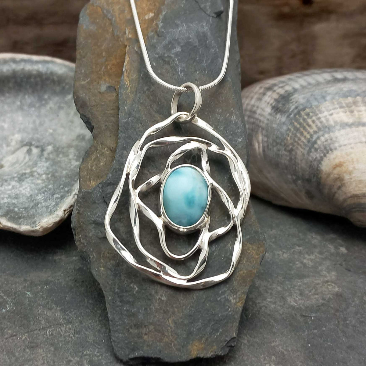 Artisan made silver necklace with Larimar blue stoen