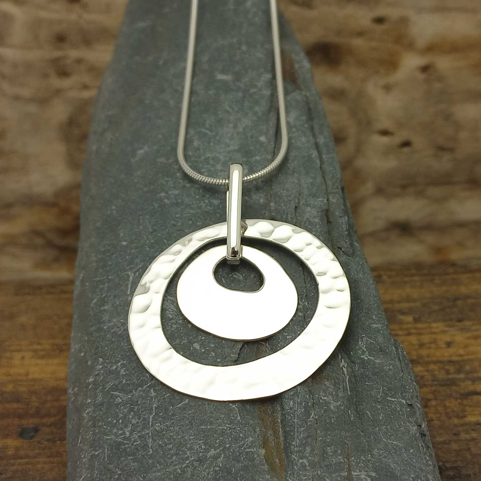 Handcrafted silver hammered circle pendant