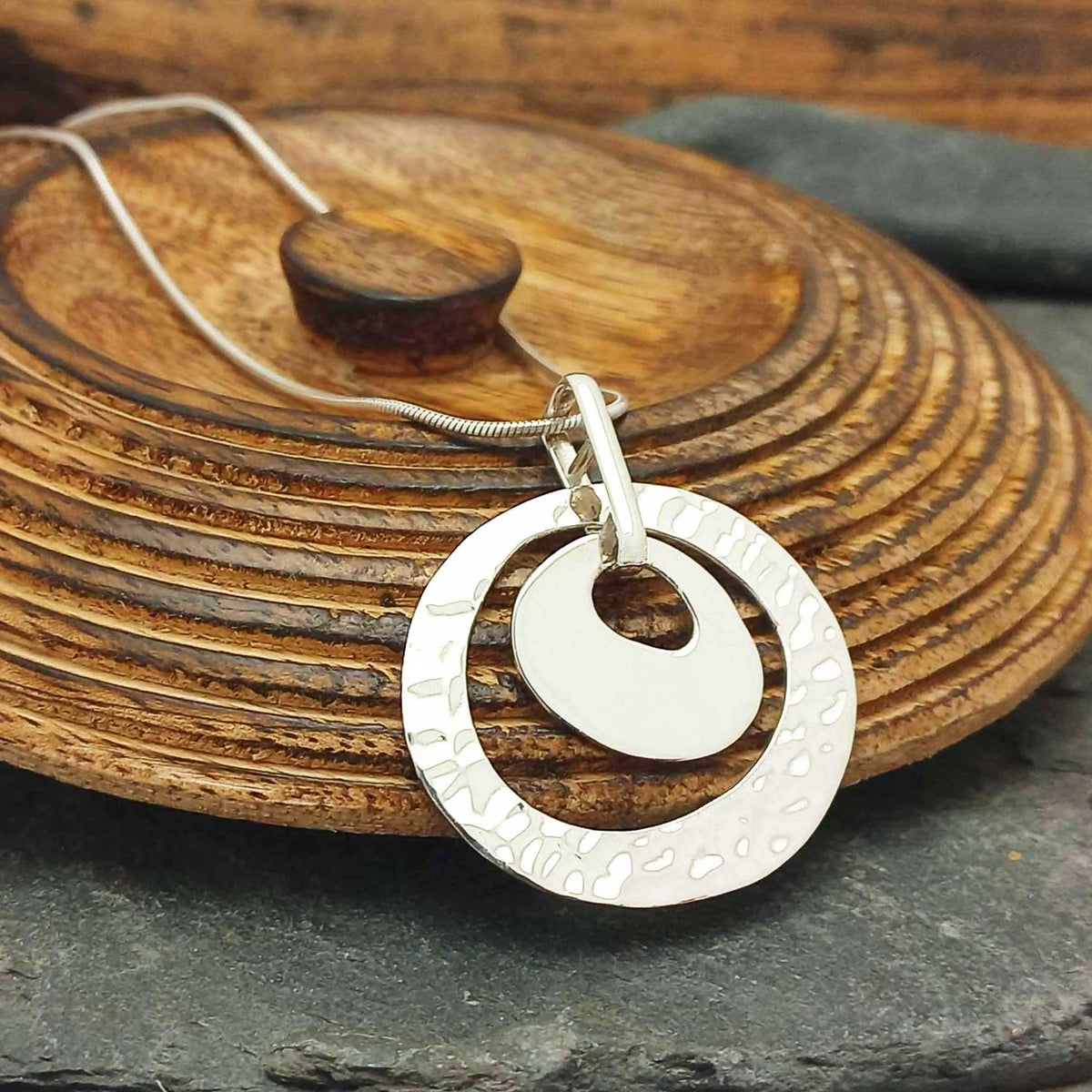 Nested oval hammered silver pendant